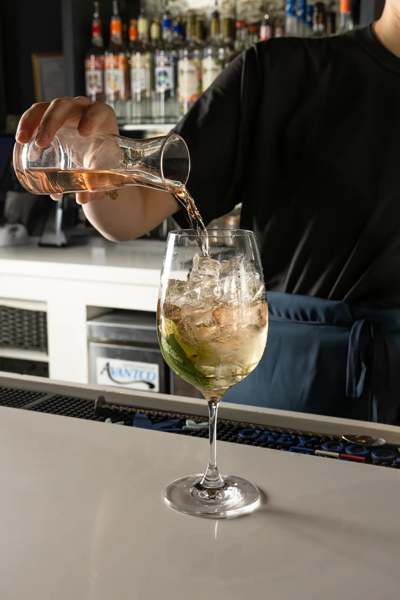 A spritz being poured at the bar